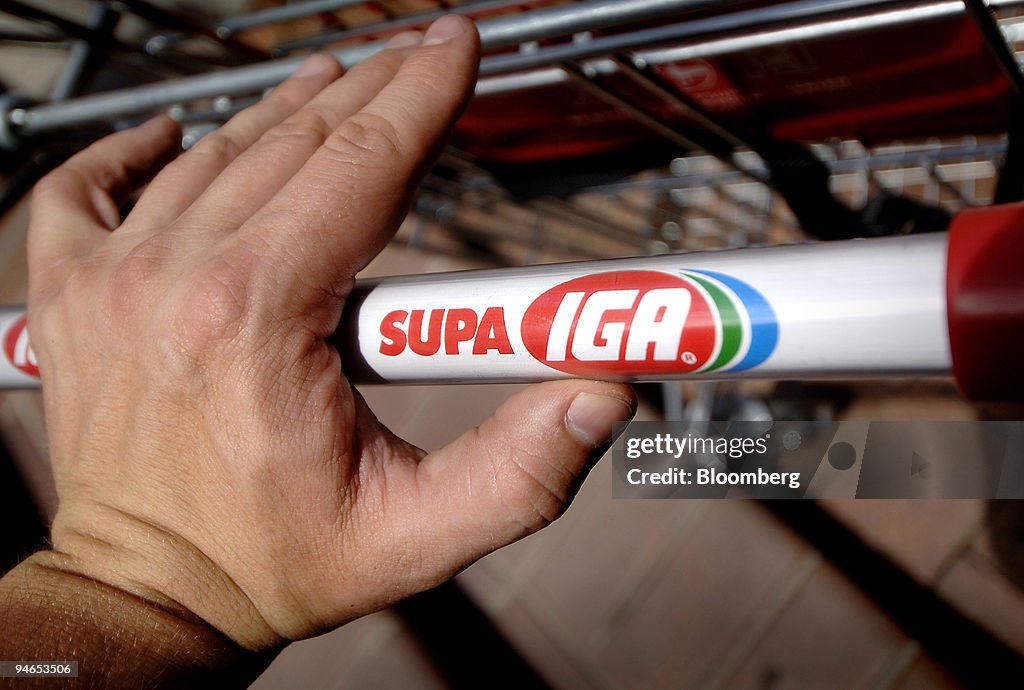 A shopper pushes a cart at an IGA supermarket in Sydney, Aus