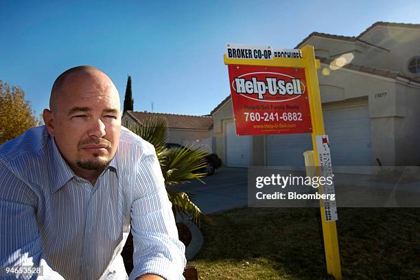 Homeowner Christopher Aultman poses in front of his house in Victorville, California, U.S., on Monday, Dec. 3, 2007. Christopher and his wife...
