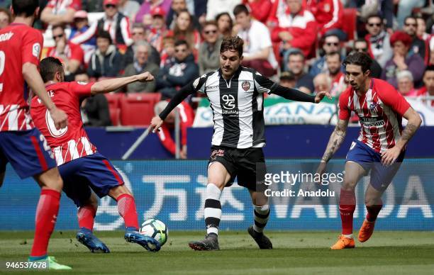 Jose Campana of Levante in action against Koke and Sime Vrsaljko of Atletico Madrid during the La Liga soccer match between Atletico Madrid and...