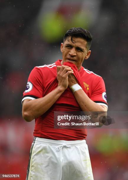 Alexis Sanchez of Manchester United reacts during the Premier League match between Manchester United and West Bromwich Albion at Old Trafford on...