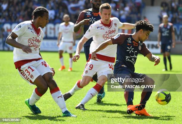 Bordeaux's French defender Jules Kounde and Bordeaux's Danish midfielder Lukas Lerager vies with Montpellier's South African forward Keagan Dolly...