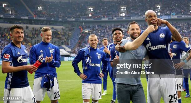 Domenico Tedesco , head coach of Schalke celebrate with Naldo after the Bundesliga match between FC Schalke 04 and Borussia Dortmund at Veltins-Arena...