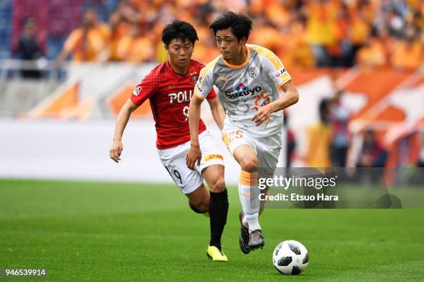 Ko Matsubara of Shimizu S-Pulse and Yuki Muto of Urawa Red Diamonds compete for the ball during the J.League J1 match between Urawa Red Diamonds and...