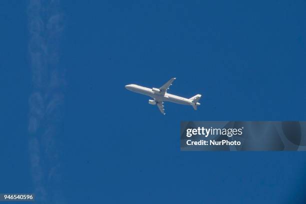 Various images of airplanes overflying Thessaloniki, Greece between 30.000-40.000 feet against the blue sky in April 2018. There are planes with the...