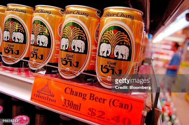 Cans of Thai Beverage Pcl's Chang Beer are pictured on a supermarket shelf in Singapore on Sunday, May 7, 2006. Thai Beverage Pcl, Thailand's largest...
