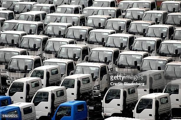 Isuzu trucks intended for export wait at a car pool in Yokohama Bay, Japan on Sunday, 23 July 2006. The Development Bank of Japan and 11 other...