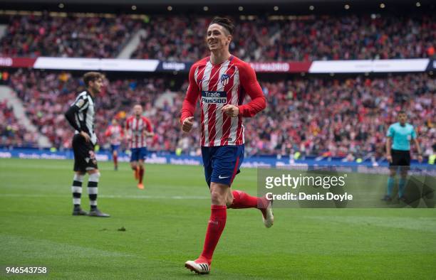 Fernando Torres of Atletico de Madrid celebrates after scoring his teamÕs third goal during the La Liga match between Atletico Madrid and Levante at...