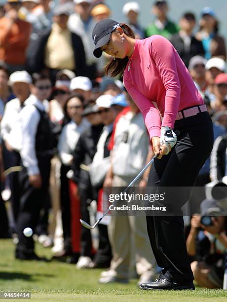 Michelle Wie watches her ball after an approach shot during the final round of the SK Telecom Open at Sky 72 Golf Club in Incheon, west of Seoul,...