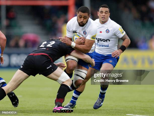 Taulupe Faletau of Bath tackled by Duncan Taylor of Saracens during the Aviva Premiership match between Saracens and Bath Rugby at Allianz Park on...