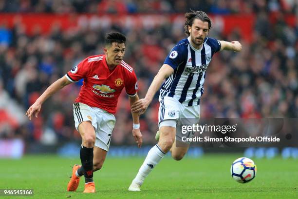 Alexis Sanchez of Man Utd battles with Jay Rodriguez of West Brom during the Premier League match between Manchester United and West Bromwich Albion...