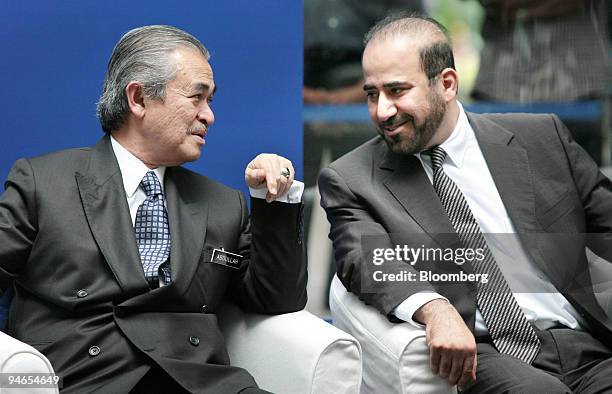 Malaysia Prime Minister Abdullah Ahmad Badawi, left, speaks with Abdullah Sulaiman, chairman of Al Rajhi Bank Malaysia, at a news conference during...