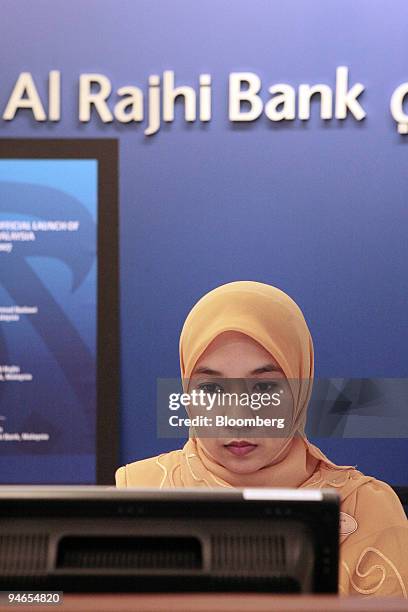 Customer relations officer is seen working at the Al Rajhi Bank in Kuala Lumpur, Malaysia, on Monday, Feb. 5, 2007.
