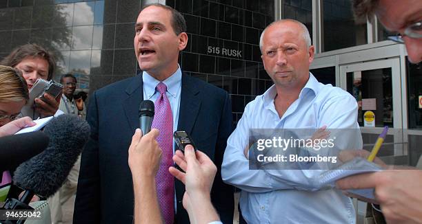 Former NatWest banker Giles Darby, right, listens to his attorney Michael Sommer, left, as he speaks to the media at the Bob Casey Federal Courthouse...