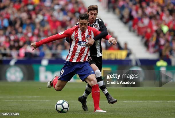 Fernando Torres of Atletico Madrid in action against Jose Campana of Levante Atletico Madrid during the La Liga soccer match between Atletico Madrid...