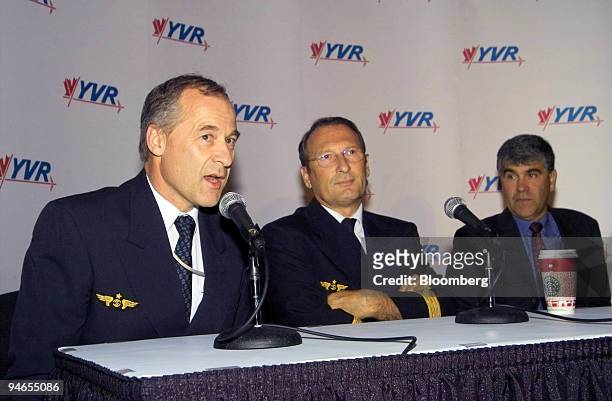 Captain Frank Chapman, left, Captain Guy Magrin, center, and Paul Levy, vice president of Airport Operations at Vancouver International Airport ,...