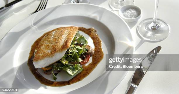 Dish of grilled Hiramasa kingfish is arranged for a photograph at the Salon Blanc restaurant in Sydney, on Monday, Feb. 5, 2007. Salon Blanc is...