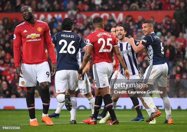 Jay Rodriguez of West Bromwich Albion celebrates after scoring his sides first goal with his team mates as Romelu Lukaku of Manchester United reacts...