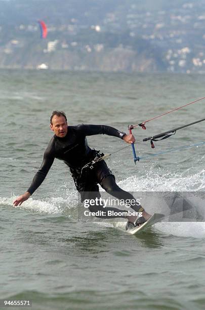 Steve Gibson with MultiVentures International and Kiter.com catches air while kiteboards in the San Francisco Bay in San Francisco, California,...