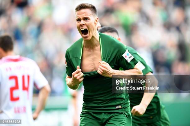 Niklas Moisander of Bremen celebrates after he scores the opening goal during the Bundesliga match between SV Werder Bremen and RB Leipzig at...