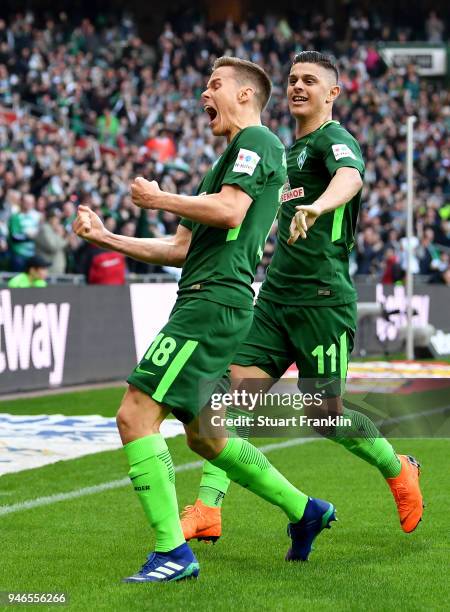 Niklas Moisander of Bremen celebrate with team mate Milot Rashica after he scores the opening goal during the Bundesliga match between SV Werder...