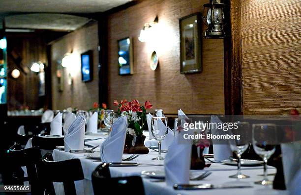 Tables are arranged at La Boite en Bois, a restaurant located near Lincoln Center at 75 West 68th Street in New York, Saturday, April 7, 2007.