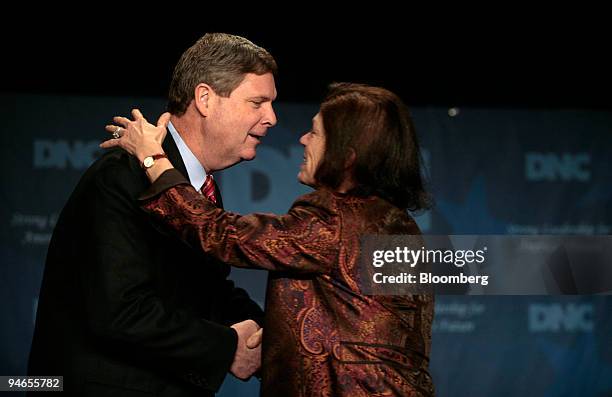 Former Iowa Governor, Tom Vilsack is greeted by Committee Secretary, Alice Germond, before speaking at the Democratic National Committee Winter...