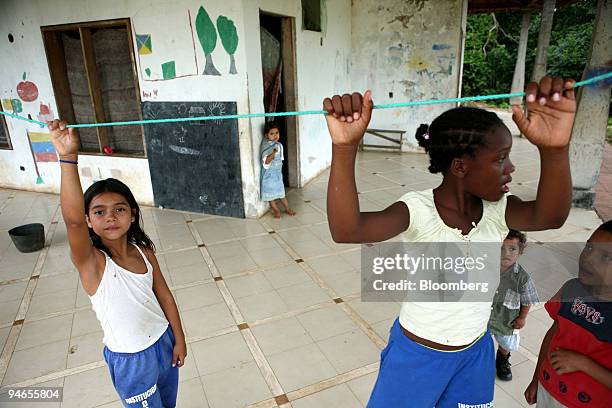 Displaced children play at Hacienda Napoles, the favored recreation home of the late infamous drug lord Pablo Escobar, near Puerto Triunfo, Colombia,...