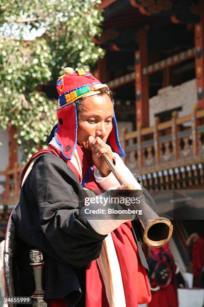 Musician plays an instrument at a festival in the dzong in Punakha, Bhutan on Tuesday, March 7, 2006. "Turn right at Mrs. Smith's House" is one of...