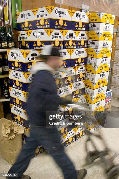 Beer deliveryman walks past a stack of Corona beer at Kappy's Liquors in Cambridge, Massachusetts, on Thursday, April 5, 2007. Constellation Brands...
