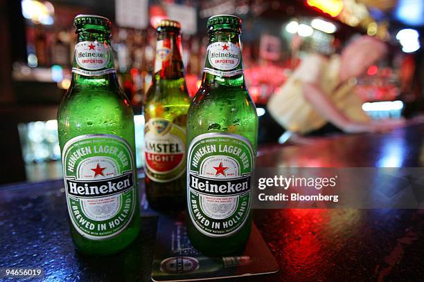 Heineken and Amstel Light beer bottles are arranged inside the Subway Inn bar in New York, Tuesday, July 18, 2006. Heineken NV, Europe's...