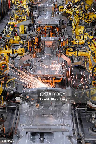 Robot welders assemble the bodies and floorpans of 2007 Nissan Titan pickup trucks and Infiniti QX56 sport utility vehicles at the Nissan North...