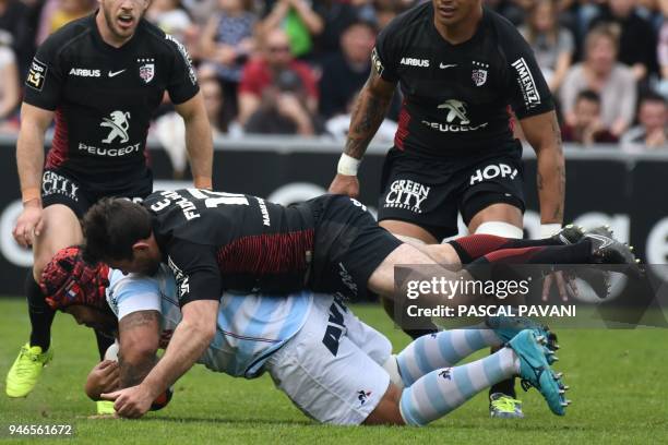 Toulouse's French centre Florian Fritz tackles Racing 92's Samoan prop Ole Avei during the French Top 14 rugby union match between Toulouse and...