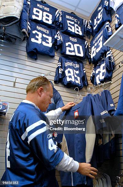 Mark Kolmer of Indianapolis shops for Indianapolis Colts apparel in the team's Pro Shop at Circle Center Mall near the RCA Dome, current home of the...