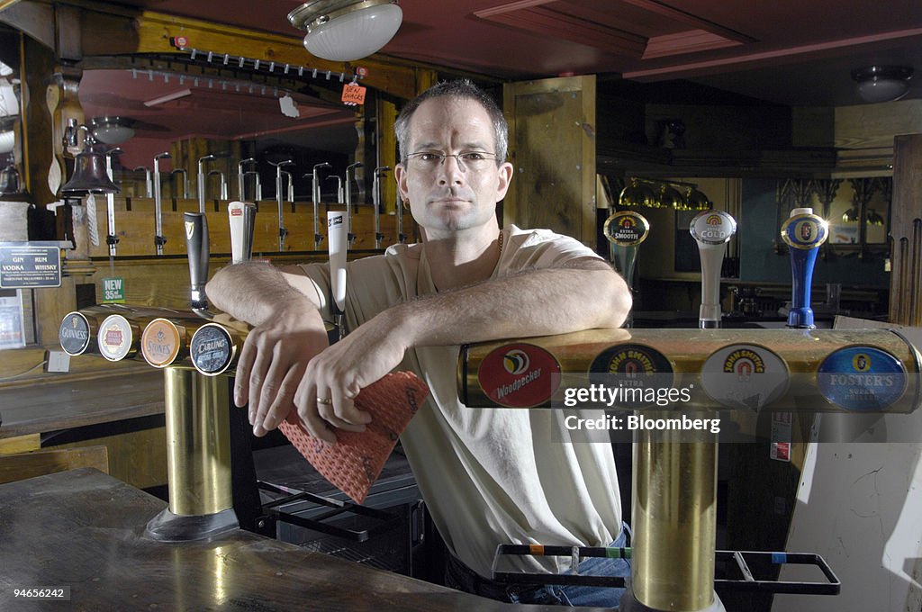 Landlord of the Plough pub, Andrew Rogerson, poses inside hi