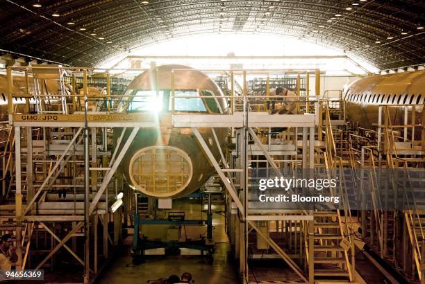 An employee works on the Embraer structural assembly line of the airplane model 170-190 at the Empresa Brasileira de Aeronautica S.A., Embraer,...