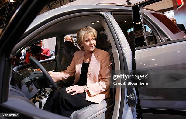 Transportation Secretary Mary E. Peters sits in the front seat of a Saturn Outlook XE during a visit to the New York International Auto Show in New...