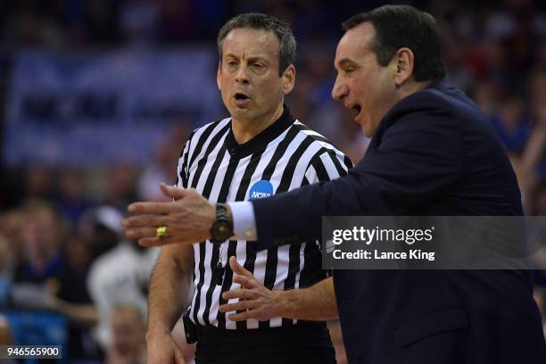 Referee Doug Sirmons explains a call to head coach Mike Krzyzewski of the Duke Blue Devils during the game against the Kansas Jayhawks during the...