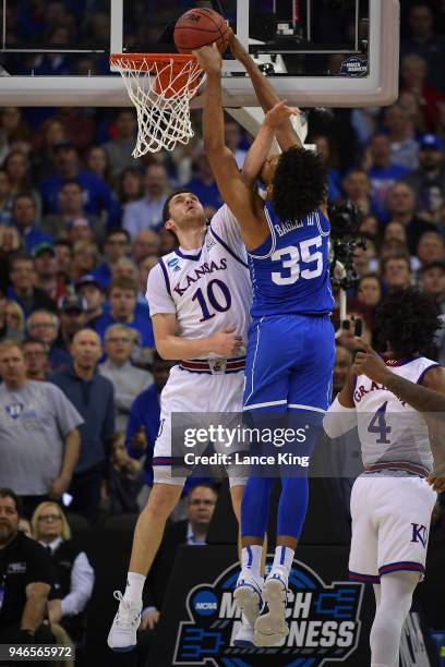 Marvin Bagley III of the Duke Blue Devils goes up for a dunk against Sviatoslav Mykhailiuk of the Kansas Jayhawks during the 2018 NCAA Men's...