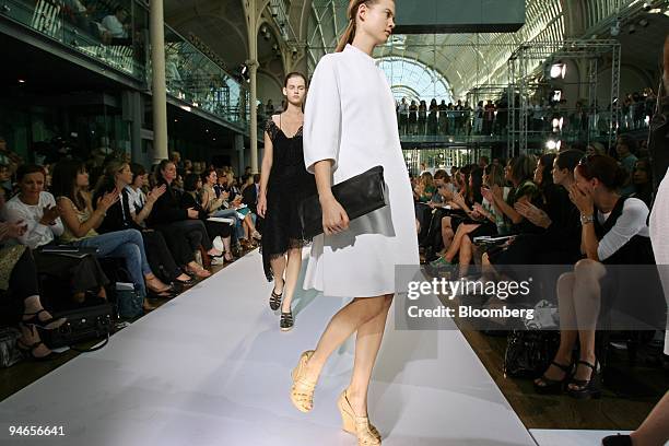 Models file down the catwalk during the showing of fashion designer Nicole Farhi's 2007 spring/summer collection in London, U.K., Thursday, September...