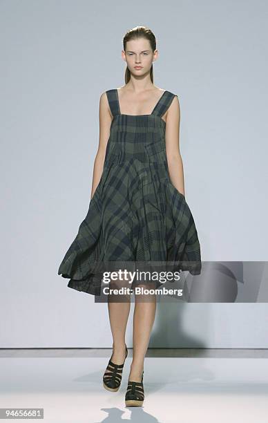 Model walks down the catwalk wearing a smog rayon plaid dress during the showing of fashion designer Nicole Farhi's 2007 spring/summer collection in...