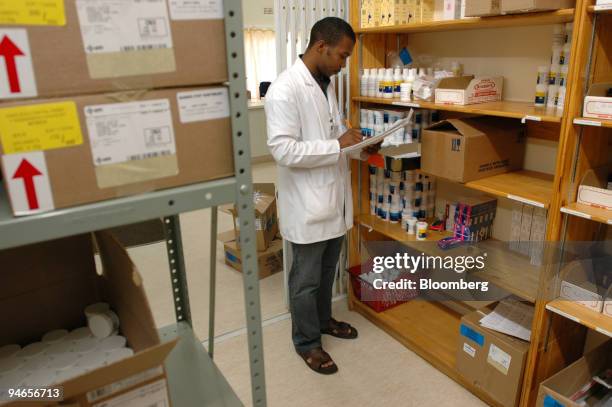 Pharmacist Bheki Dube does a stock take of antiretroviral drugs at the rural Emmaus Hospital, 20km from Bergville, Kwa Zulu/Natal, South Africa, on...