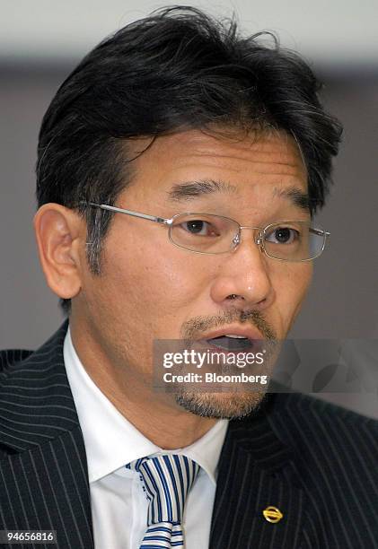 Joji Tagawa, corporate vice president of Nissan Motor Co., speaks at a news conference announcing Nissan's third-quarter results at the company's...