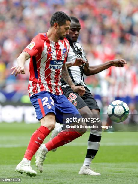 Vitolo of Atletico Madrid, Aly Abeid of Levante during the La Liga Santander match between Atletico Madrid v Levante at the Estadio Wanda...