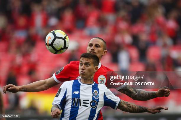 Porto's Brazilian midfielder Otavio vies with Benfica's Serbian midfielder Ljubomir Fejsa during the Portuguese league footbal match between SL...