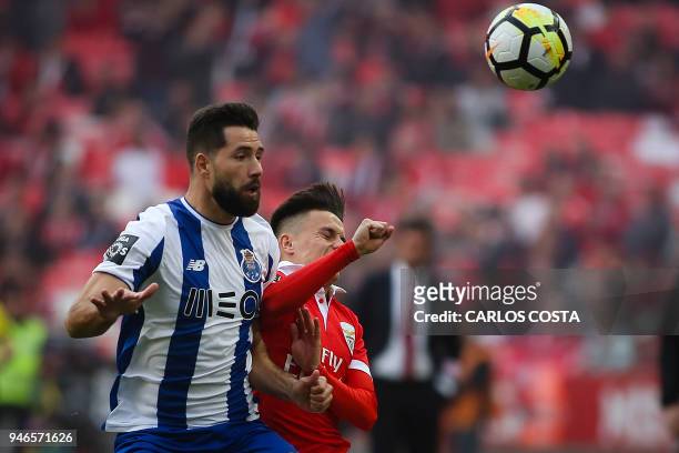 Porto's Brazilian defender Felipe vies with Benfica's Argentinian forward Franco Cervi during the Portuguese league footbal match between SL Benfica...