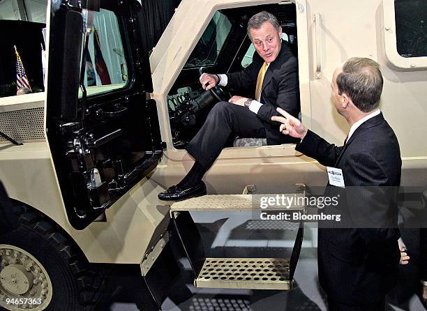 Richard Burr, U.S. Republican U.S. Senator of North Carolina, left, speaks with Daniel Busher, executive vice president at Force Protection Inc.,...