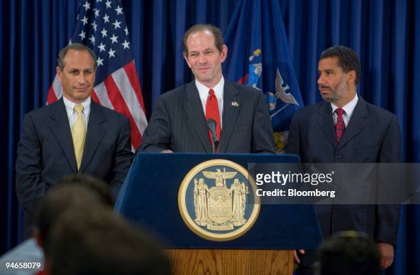 New York Governor Eliot Spitzer, center, speaks at a news briefing on the condition of New York State's bridges, as Lieutenant Governor David...