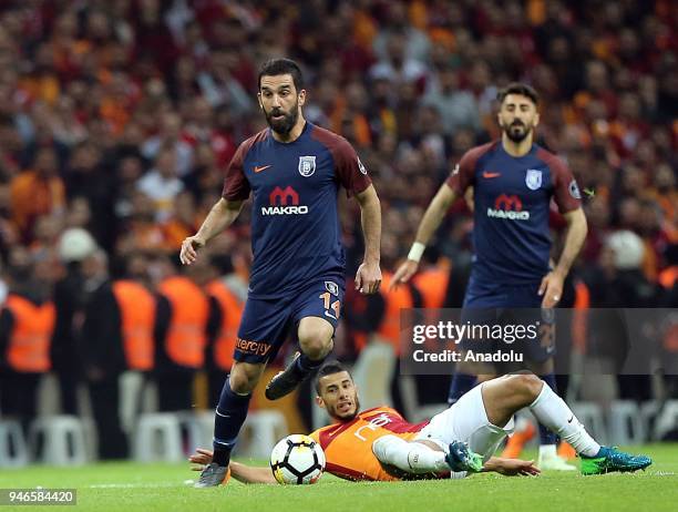 Belhanda of Galatasaray in action against Arda Turan of Medipol Basaksehir during the Turkish Super Lig soccer match between Galatasaray and Medipol...