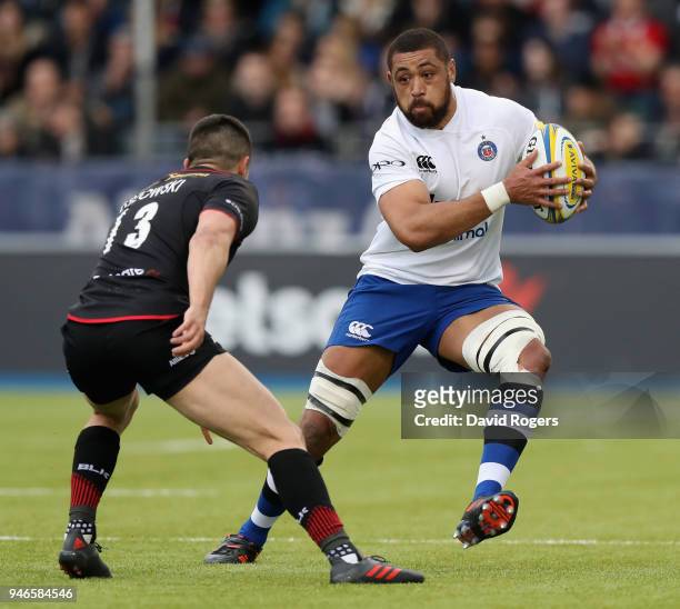 Taulupe Faletau of Bath takes on Alex Lozowski during the Aviva Premiership match between Saracens and Bath Rugby at Allianz Park on April 15, 2018...