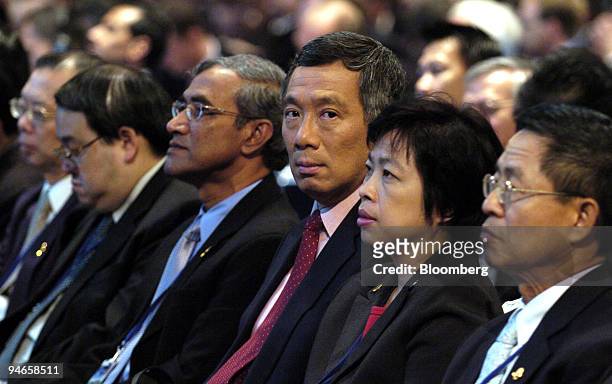 Singapore Prime Minister and Finance Minister, Lee Hsien Loong, third from right, attends the opening plenary session of the international Monetary...